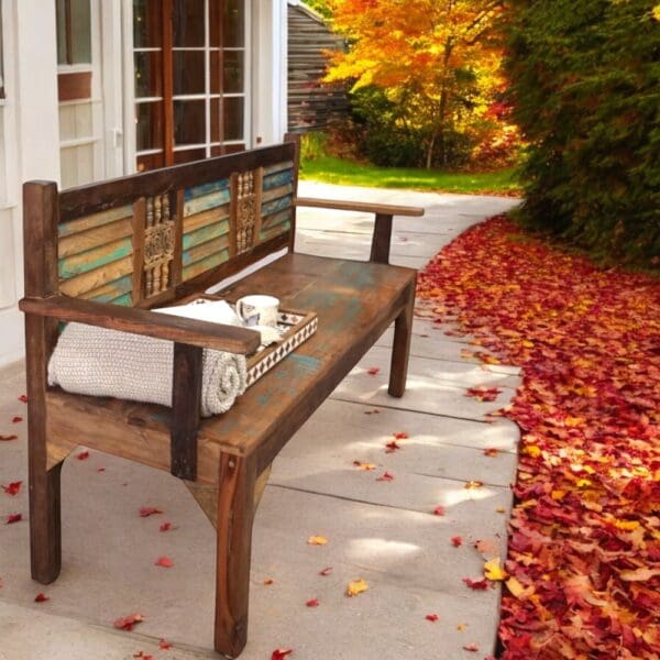 reclaimed wood bench staged on a fall porch