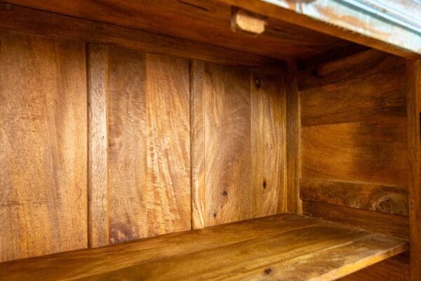 A wooden shelf with some wood in it