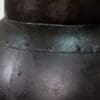 A close up of the metal armor on a table