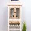 A white and wood cabinet with plants in the middle of it.