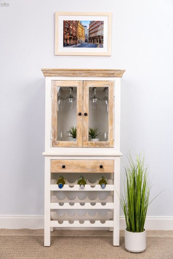 A white and wood cabinet with plants in the middle of it.