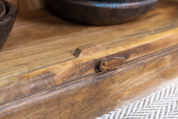 A wooden table with some wood pieces on it