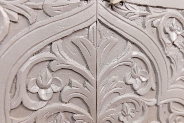 A close up of the door of an ornate room.