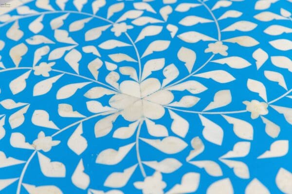 A close up of the blue and white pattern on the floor