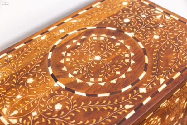 A close up of the wooden surface with intricate designs.