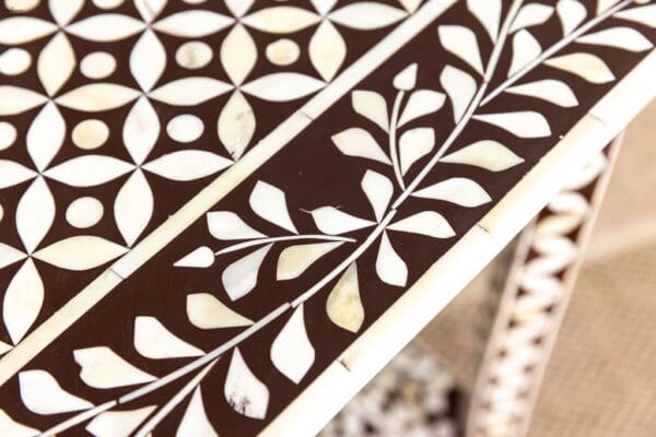 A close up of the inlay on a table