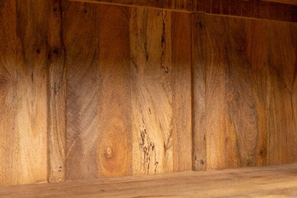 A wooden wall with some wood grain on it