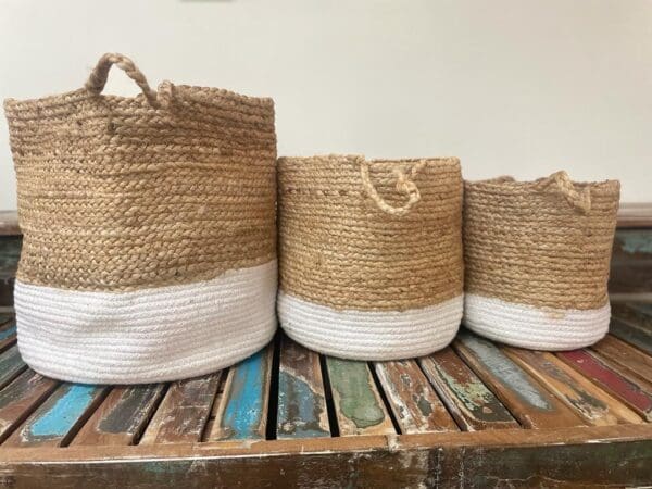 Three baskets are lined up on a table.