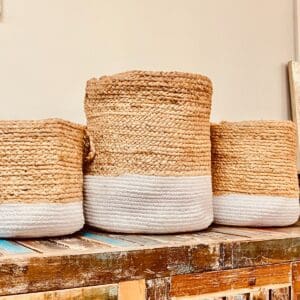 Three baskets are lined up on a table.