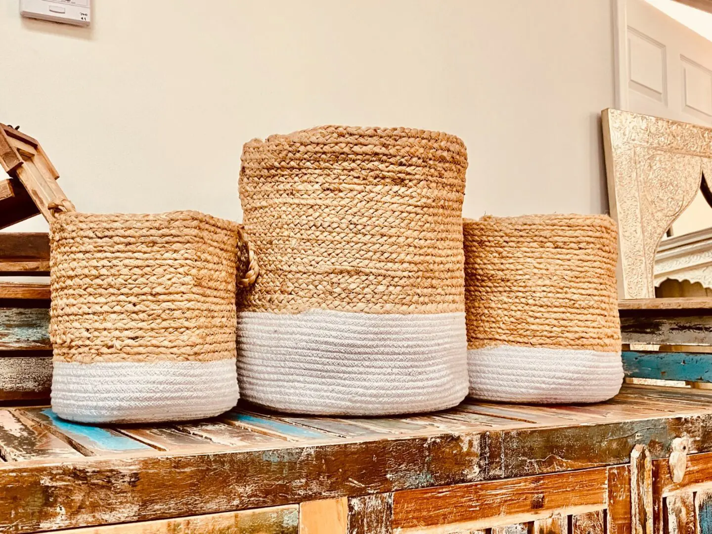 Three baskets are lined up on a table.