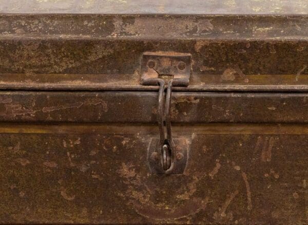 A close up of the handle on an old metal box