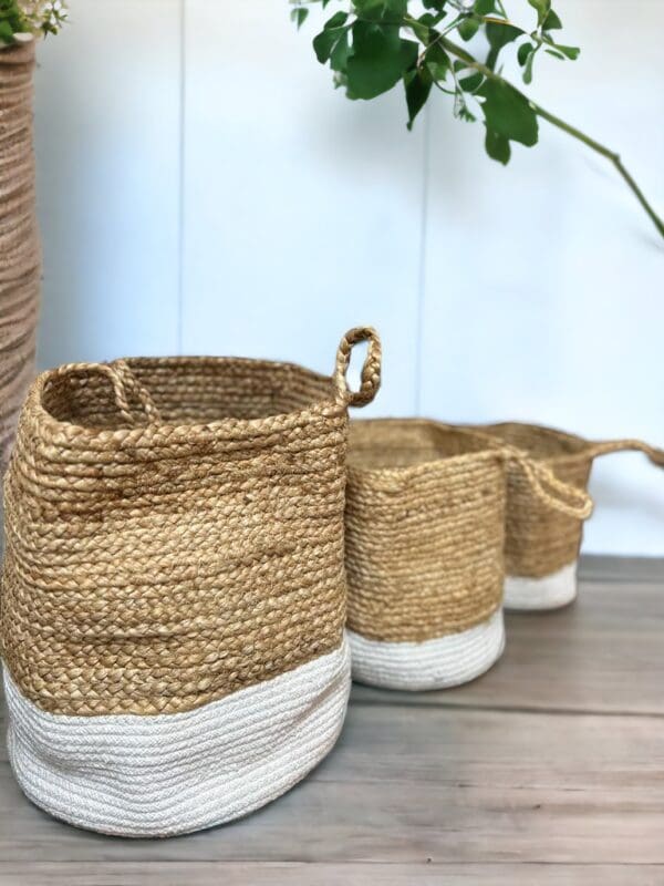 Three baskets are lined up on a table.