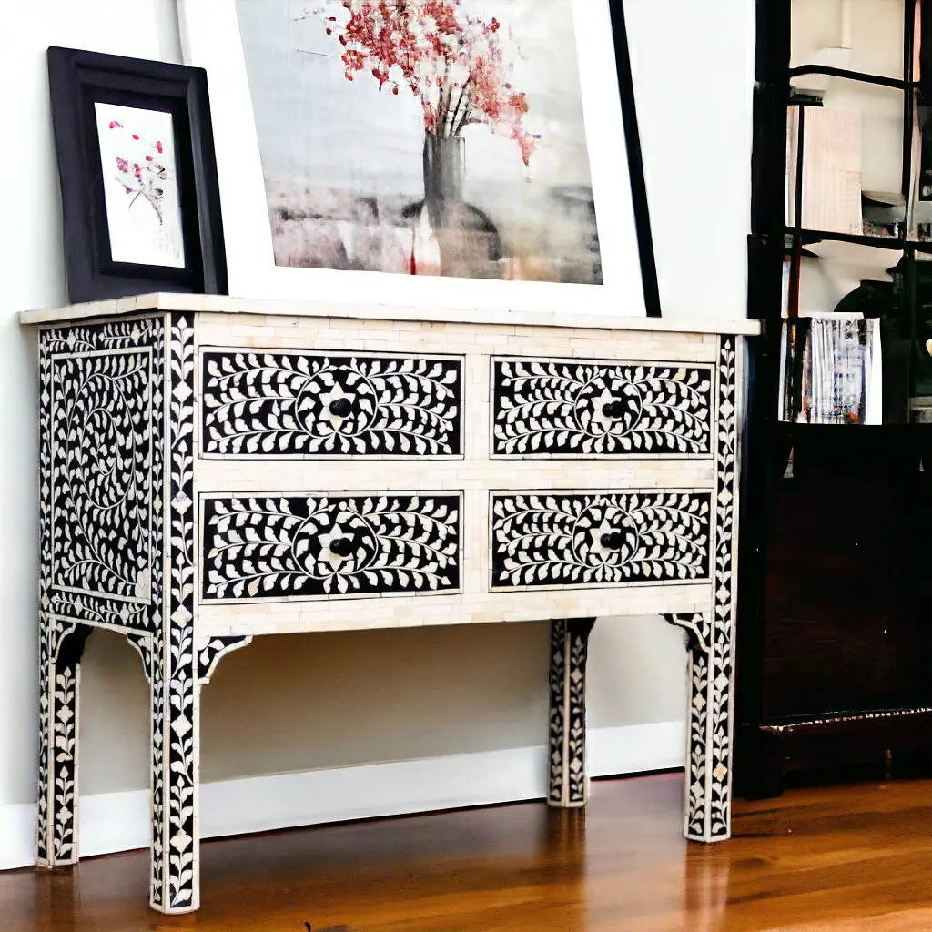 A black and white bone inlay console table with four drawers