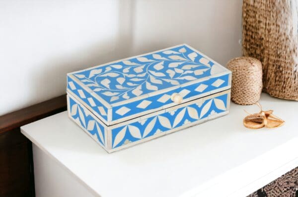 A blue and white box sitting on top of a table.