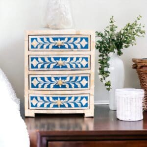 A dresser with blue and white designs on it.