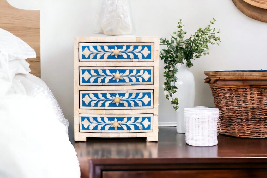 A dresser with blue and white designs on it.
