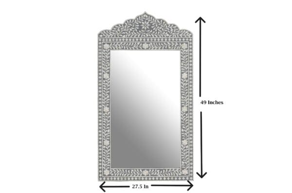 A mirror with a large frame and small decorative design.