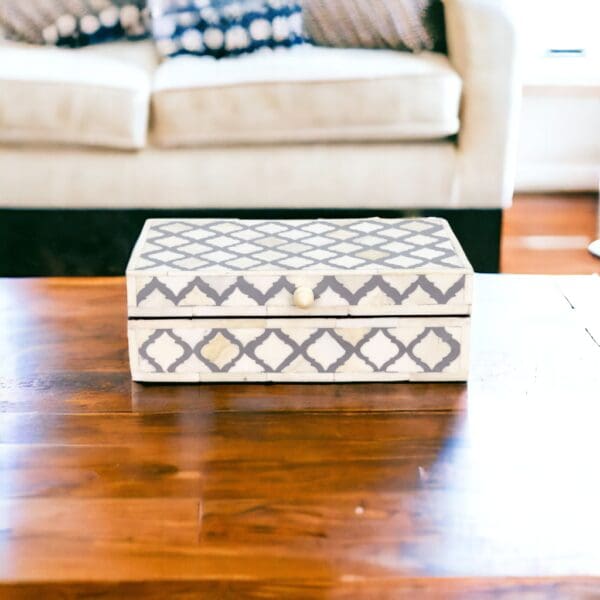 A wooden table with a box on top of it