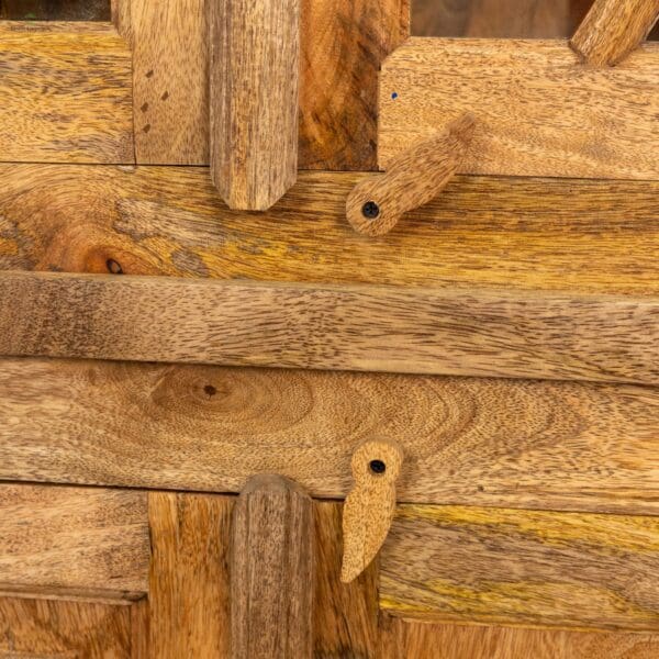 A close up of wooden planks with holes in them.