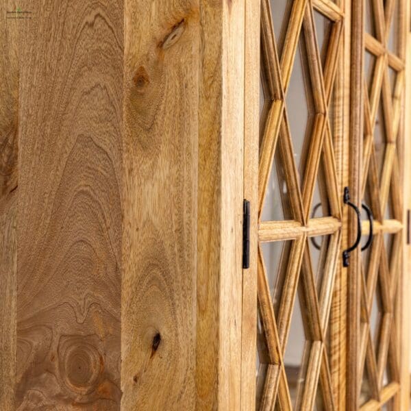 A close up of the door of a wooden cabinet