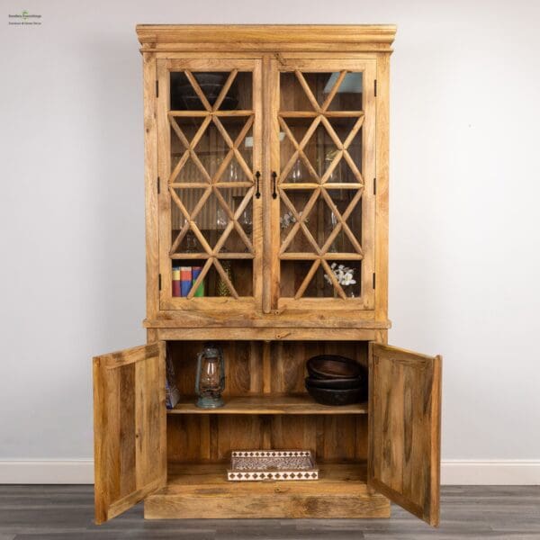 A wooden cabinet with two doors open to reveal shelves.