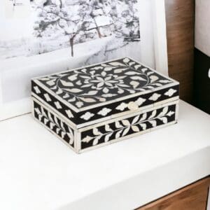 A black and white box sitting on top of a table.