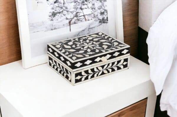 A black and white box sitting on top of a table.