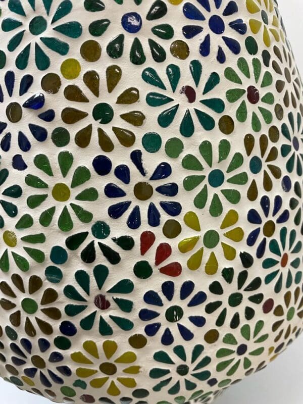 A close up of the colorful ceramic vase