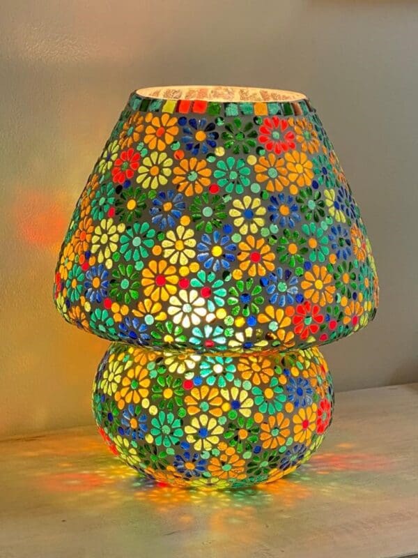 A colorful lamp with flowers on it