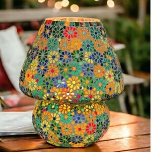 A colorful lamp sitting on top of a wooden table.