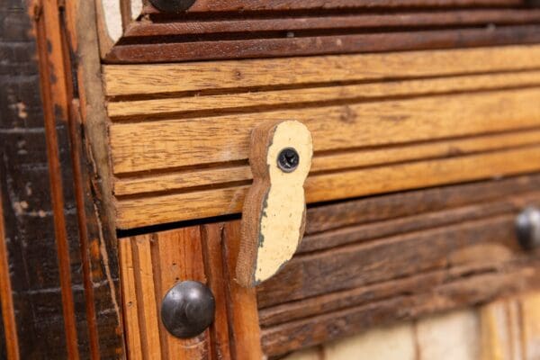 A wooden door with a handle and lock.