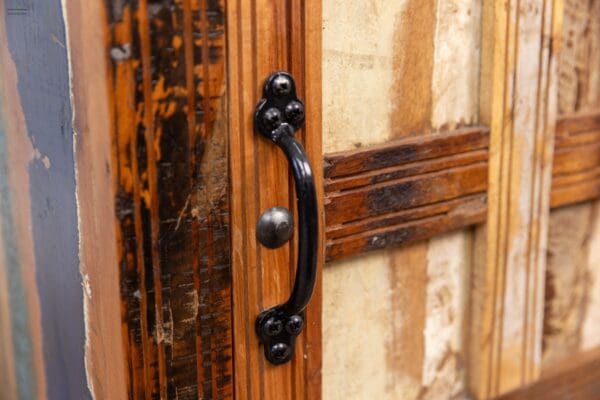 A close up of the handle on an old door