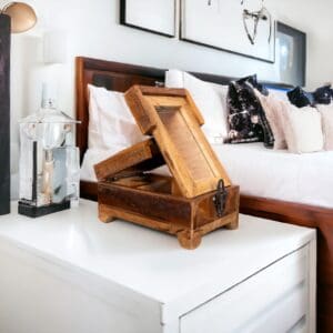 A wooden box on top of a white table.