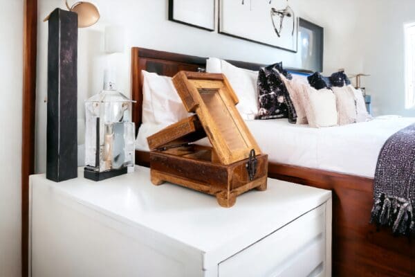 A wooden box on top of a white table.