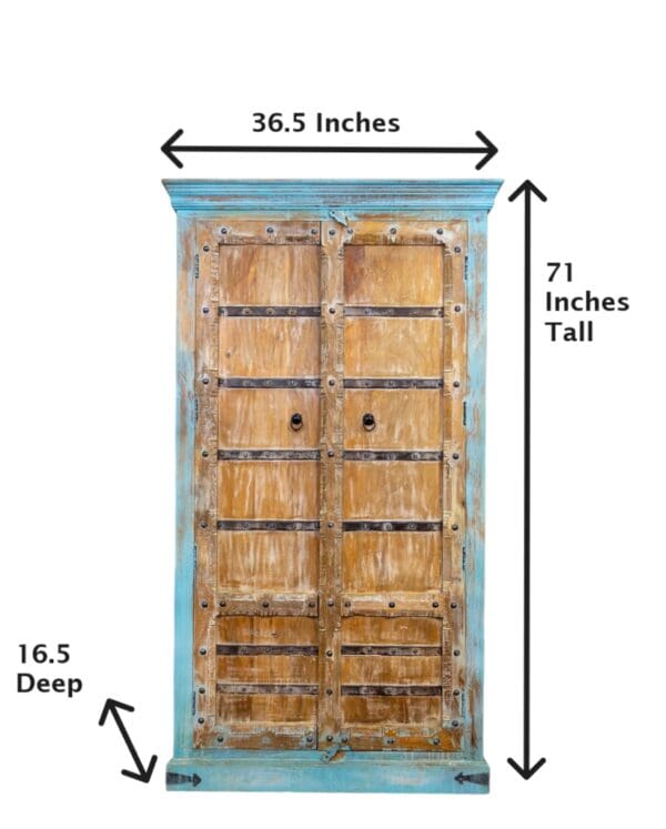 A large blue wooden door with measurements on it.