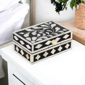 A black and white box on top of a table.