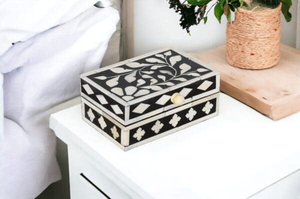 A black and white box on top of a table.