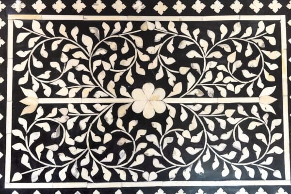 A black and white floral pattern on the wall.
