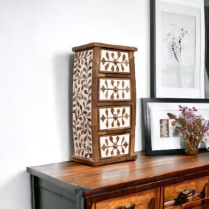 A hand-crafted teak inlay caddy with four drawers and a picture on the wall.