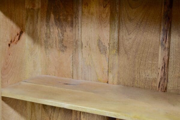 A wooden shelf with some wood on it