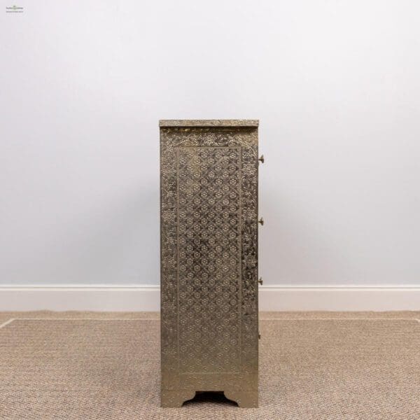 A metal cabinet with a diamond pattern on the front.