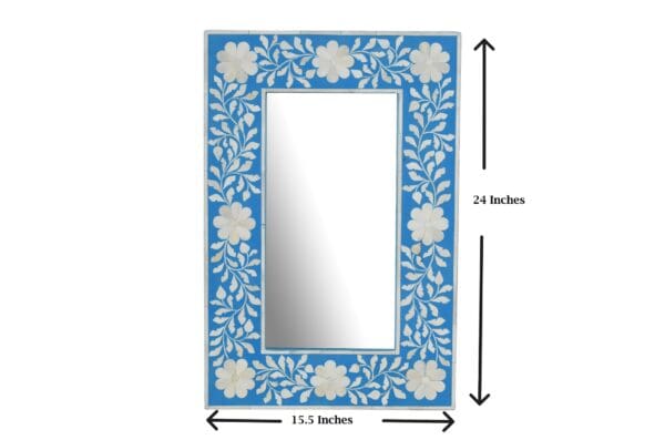 A mirror with blue and white floral design