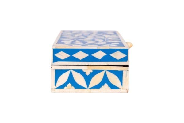 a blue and white keepsake box, in hand-crafted bone inlay on a white background