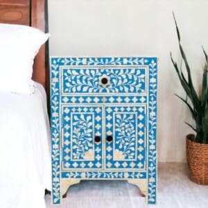 blue and white floral nightstand staged in a bedroom