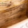 A close up of the wood grain on the table.