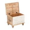 A wooden trunk with a white lid and feet.