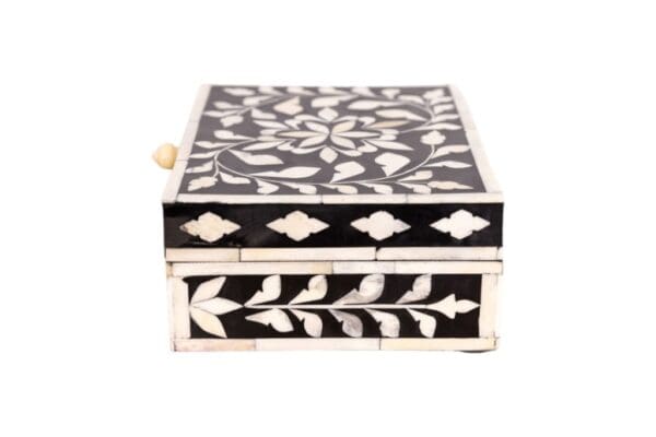 floral black and white box in hand-crafted bone inlay on a white background