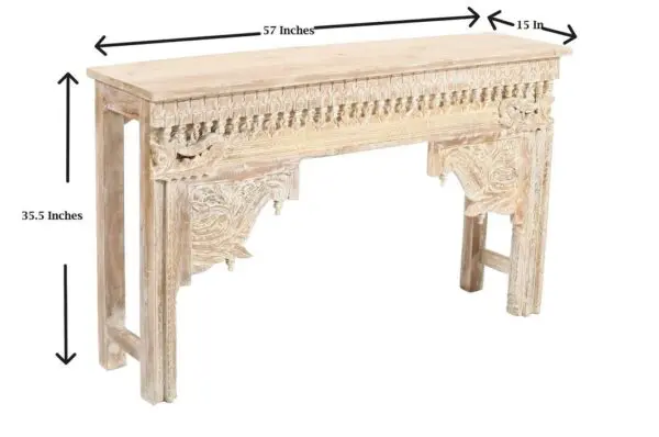 A wooden table with a carved design on it.