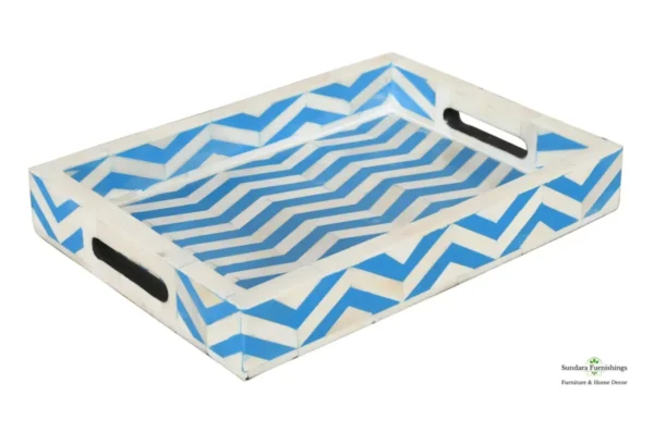 A blue and white tray with handles