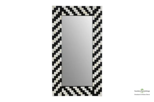 A mirror with black and white stripes on it.